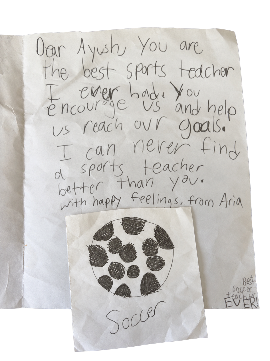 Handwritten note from Aria: Dear Ayush, you are the best sports teacher I ever had. You encourage us and help us reach our goals. I can never find a sports teacher better than you. With happy feelings, from Aria. Best soccer teacher ever!